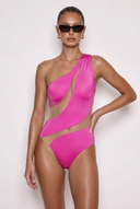 Front view of the Room 24 Freya fuchsia one-piece swimsuit with an asymmetric shoulder and sweeping illusion-mesh cut-outs.