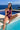 Front view of the Room 24 Freya bordeaux one-piece swimsuit with an asymmetric shoulder and sweeping illusion-mesh cut-outs.