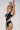 Side view of the Room 24 Freya black one-piece highlighting its curved illusion-mesh panels and high-cut leg.