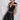 Side view of the Room 24 Rosy Top showing its deep neckline, sheer shoulder panel and body-contouring fit.