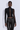 Front view of the Room 24 Joyce top with a high neckline, sheer centre panel and asymmetric long sleeves.