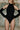 Front view of the Room 24 Grace black halterneck bodysuit with a sculpted fit and coordinating opera gloves.