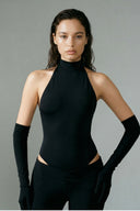 Front view of the Room 24 Grace black halterneck bodysuit with a sculpted fit and coordinating opera gloves.