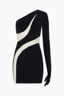 Close-up of the Room 24 Holly black dress showing its asymmetric neckline, layered fabric panels and sculptural cut-out detailing.