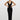 Front view of the Room 24 Kaya black maxi dress with a deep V neckline, geometric waist cut-outs and fitted silhouette.