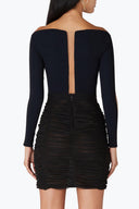 Back view of the Room 24 Laine skirt highlighting its high-rise waist, gathered texture and body-contouring fit .