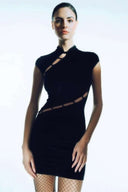 Front view of the Room 24 Lin black velvet mini dress with a high neckline, cap sleeves and asymmetric waist cut-out.