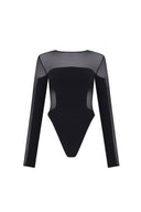 Close-up of the Room 24 Melis bodysuit highlighting its sheer mesh construction and sculptural waist detailing.