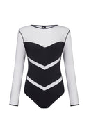Close-up of the Room 24 Milan bodysuit showing the sheer mesh fabric and geometric chevron panel construction.