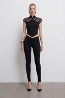 Front view of the Room 24 May Top featuring a high collar, sheer mesh panels, sculptural neckline cut-outs and beaded knot fastenings.