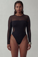 Front view of the Room 24 Melis bodysuit with long mesh sleeves, a sheer shoulder panel and curved waist detailing.