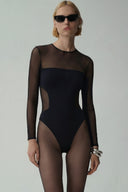 Front view of the Room 24 Melis bodysuit with long mesh sleeves, a sheer shoulder panel and curved waist detailing.