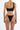 Back view of woman wearing black one-shoulder bikini with braided strap bottoms