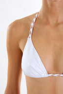 Close-up of the Room 24 Iris bikini top showing its braided straps and gathered stretch fabric.