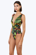 Side view of the Room 24 Amelia one-piece highlighting its crossover waist, sculpted fit and high-cut leg.
