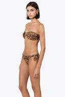 Side view of the Room 24 Stella reversible bikini bottom highlighting its knotted detail and high-cut shape.