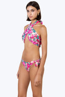 Side view of the Room 24 Stella reversible bikini bottom highlighting its knotted detail and high-cut shape.