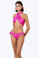 Side view of the Room 24 Stella reversible bikini bottom highlighting its knotted detail and high-cut shape.