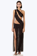 Front view of the Room 24 Marina black sheer maxi dress with asymmetric draping, sculptural cut-outs and a thigh-high split.