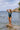 Front view of the Room 24 Rachel one-piece swimsuit with a deep plunge neckline, gathered panels and crossover waist.
