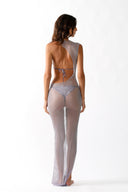 Back view of the Room 24 Renie lilac sheer maxi dress showing its crystal net fabric and asymmetric full-length silhouette.