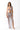 Woman modeling sheer mesh cut-out dress over metallic bikini, beachwear fashion