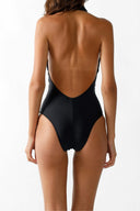 Back view of the Room 24 Venus swimsuit showing its halterneck construction, dramatic low back and sculpted fit.