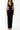 Close-up of the Room 24 Kaya black dress showing the deep V neckline, under-bust cut-outs and smooth stretch fabric.