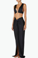 Front view of the Room 24 Sharon maxi skirt with a V-shaped waist, gathered detail and front slit.