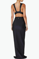 Back view of the Room 24 Sharon skirt showing its smooth waist and close-fitting maxi silhouette.