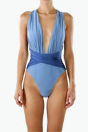 Front view of the Room 24 Rachel one-piece swimsuit with a deep plunge neckline, gathered panels and crossover waist.