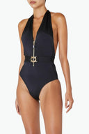 Side view of the Room 24 Zelda one-piece highlighting its defined waist, sculpting fit and open-back construction.