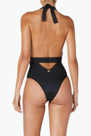 Back view of the Room 24 Zelda swimsuit showing its adjustable halterneck tie, open back and curved waist cut-out.