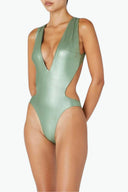 Side view of the Room 24 Fanny one-piece swimsuit highlighting its curved waist cut-outs and body-contouring silhouette.