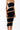 Side view of the Room 24 Sienna black midi dress showing its diagonal sheer panels and body-contouring shape.