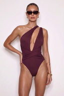 Front view of the Room 24 Sofia burgundy one-piece swimsuit with an asymmetric neckline, plunge front and crossover waist.