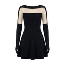 Close-up of the Room 24 Sola black dress showing the bateau neckline, sheer illusion mesh and straight-cut bodice.