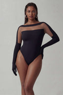 Front view of the Room 24 Solera black bodysuit with a sheer mesh yoke, boat neckline and integrated glove sleeves.