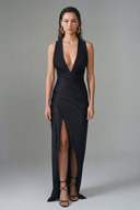 Front view of the Room 24 Silvy black maxi dress with a deep plunge neckline, draped wrap waist and centre slit.
