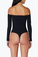 Back view of the Room 24 Taylor black off-shoulder bodysuit highlighting its fitted long sleeves and streamlined thong silhouette.