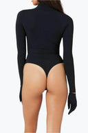 Back view of the Room 24 Ashanti black corset bodysuit highlighting its high neckline, fitted sleeves and thong silhouette.