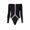 Close-up of the Room 24 Regina black bodysuit showing the wide neckline, deep plunge illusion-mesh panel and smooth stretch fabric.