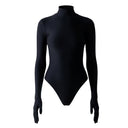 Close-up of the Room 24 Jane black bodysuit showing the raised texture and high turtleneck.