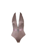 Close-up of the Room 24 Zelda swimsuit showing its centre-front zip, halterneck construction and decorative belt buckle.