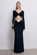 Front view of the Room 24 Bella black reversible maxi dress styled with a twisted V-neckline, curved waist cut-out and long sleeves.