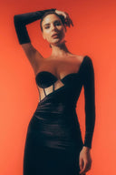 Front view of the Room 24 Emily black corset maxi dress with underwired cups, one long glove sleeve and a thigh-high split.