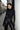 Front view of the Room 24 Jane black bodysuit with a high neckline, long sleeves 