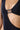 Close-up of the Room 24 Leona swimsuit showing the gathered neckline and circular metal accent beneath the bust.