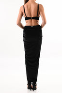 Back view of the Room 24 Pam skirt highlighting its high-rise waist, fitted silhouette and maxi length.