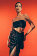 Side view of the Room 24 Pam maxi skirt showing its sculpted fit, gathered detailing and statement split.